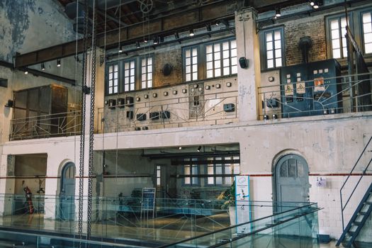 Explore this vintage industrial factory interior with exposed bricks and machinery, ideal for design concepts.